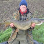 Dennis Moules holding large pike